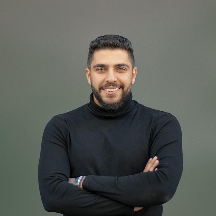 Avery Chen, Lead Design Curator at Crystal Valley Station, reviewing corporate floral arrangements